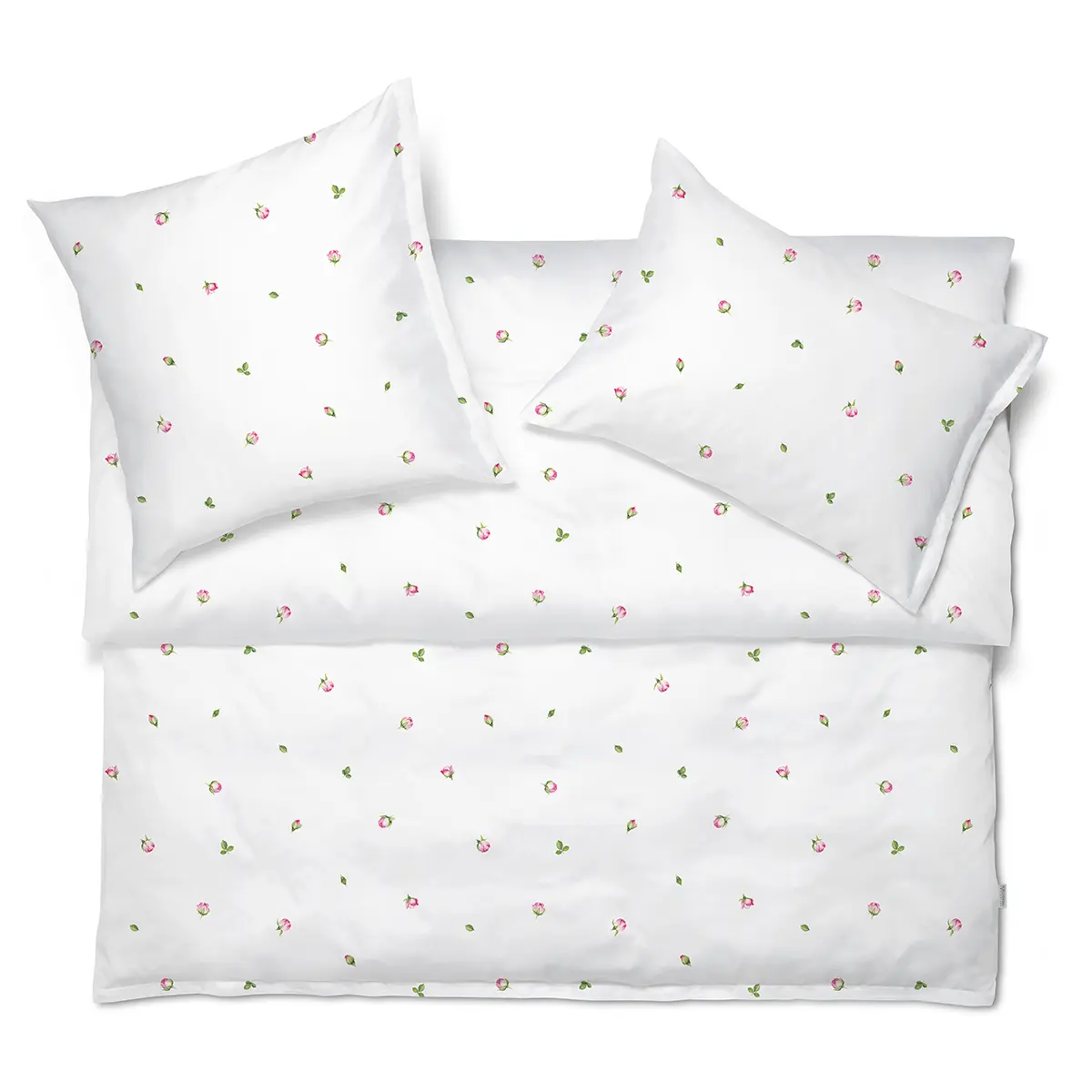 Jeunesse-Bettwäsche Set in romantischem Design Jeunesse-Bettwäsche Set mit feinem Blumenmuster, das kleine rosa Blüten und grüne Blätter auf einem weissen Hintergrund zeigt.